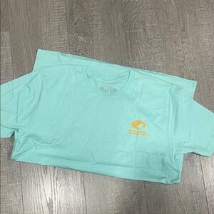 Costa Light Blue Tee with Yellow Logo